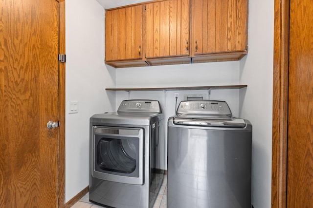 5357 Winding Creek Dr Unit 5357, Rockford, IL 61114 - washroom with cabinet space, separate washer and dryer, and light tile patterned floors