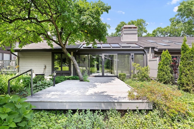 5357 Winding Creek Dr Unit 5357, Rockford, IL 61114 - rear view of property with a wooden deck, a chimney, roof with shingles, and french doors