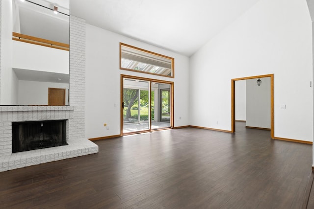 5357 Winding Creek Dr Unit 5357, Rockford, IL 61114 - unfurnished living room with high vaulted ceiling, dark wood-type flooring, and a fireplace