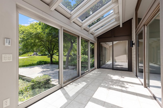 5357 Winding Creek Dr Unit 5357, Rockford, IL 61114 - unfurnished sunroom featuring a skylight, tile patterned flooring, and vaulted ceiling