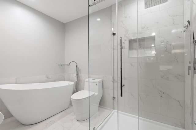 5357 Winding Creek Dr Unit 5357, Rockford, IL 61114 - full bath with marble finish floors, a freestanding bath, tile walls, a stall shower, and wainscoting