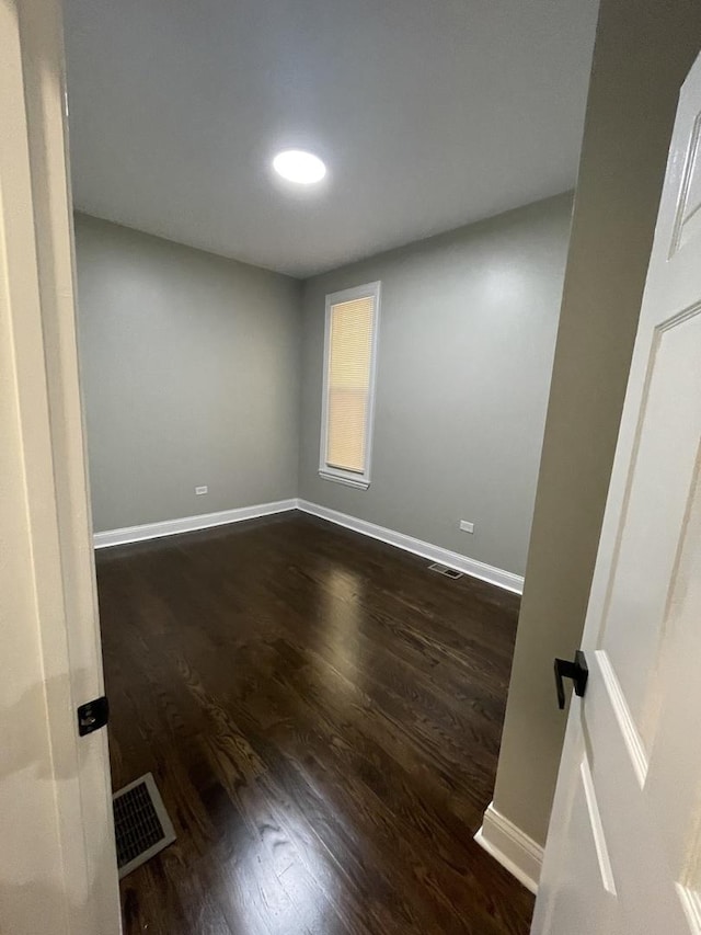6239 S Bishop St, Chicago, IL 60636 - spare room featuring dark wood finished floors and baseboards