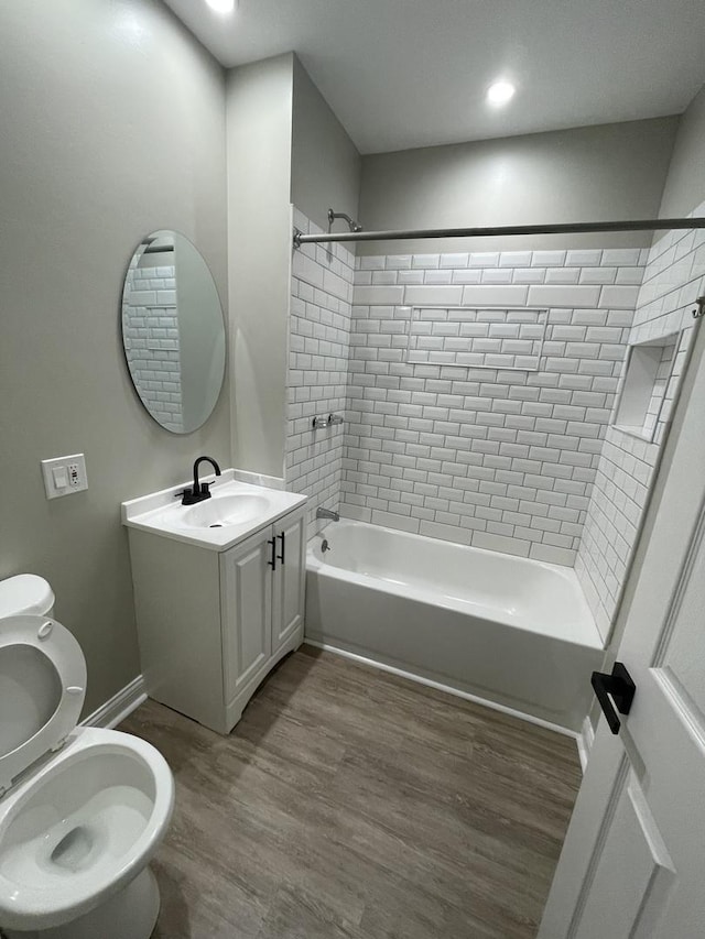 6239 S Bishop St, Chicago, IL 60636 - bathroom with washtub / shower combination, wood finished floors, vanity, and recessed lighting
