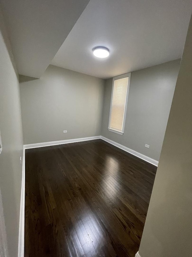 6239 S Bishop St, Chicago, IL 60636 - empty room with dark wood-style flooring and baseboards
