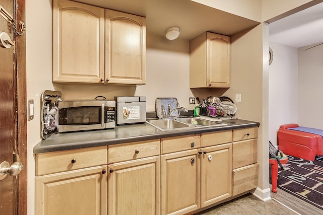 5113 N E River Rd Unit 1M, Chicago, IL 60656 - kitchen with light brown cabinets, stainless steel microwave, and dark countertops