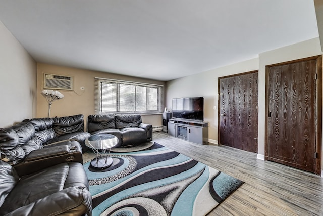 5113 N E River Rd Unit 1M, Chicago, IL 60656 - living room with a wall unit AC and light wood-style floors