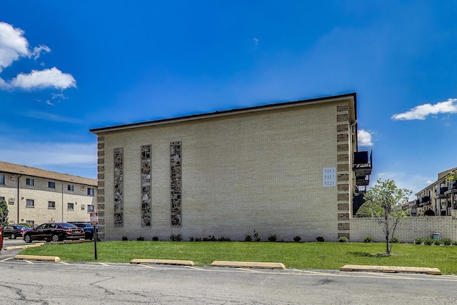 5113 N E River Rd Unit 1M, Chicago, IL 60656 - view of building exterior with uncovered parking