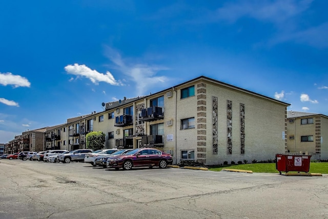 5113 N E River Rd Unit 1M, Chicago, IL 60656 - view of building exterior featuring uncovered parking