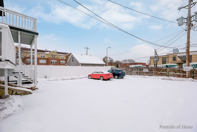 127 N W St, Wheaton, IL 60187 - yard covered in snow featuring a residential view and stairway