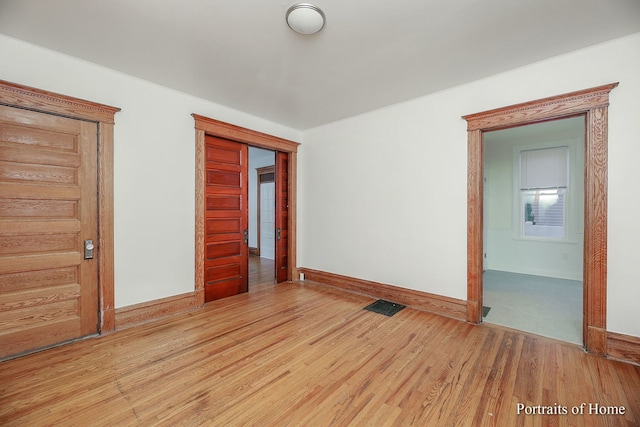 127 N W St, Wheaton, IL 60187 - empty room featuring baseboards and light wood-style floors