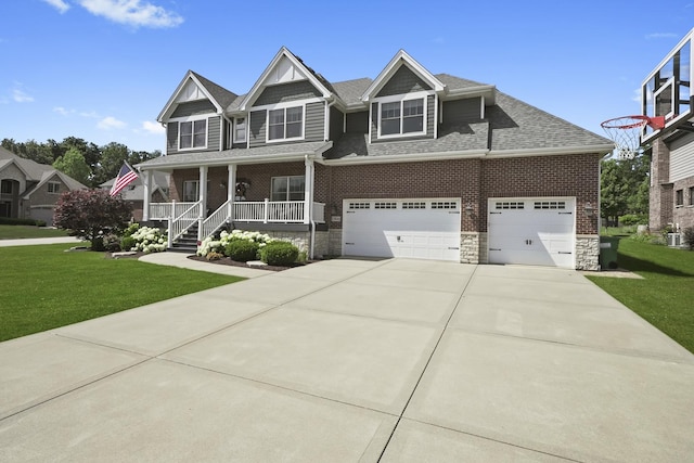 13616 S Erin Dr, Homer Glen, IL 60491 - craftsman-style home featuring covered porch, a front lawn, driveway, roof with shingles, and stone siding