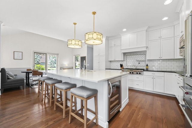 13616 S Erin Dr, Homer Glen, IL 60491 - kitchen with wine cooler, stainless steel gas stovetop, backsplash, white cabinets, and recessed lighting