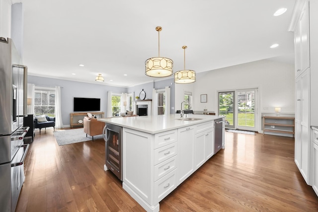 13616 S Erin Dr, Homer Glen, IL 60491 - kitchen featuring beverage cooler, open floor plan, recessed lighting, white cabinetry, and light countertops