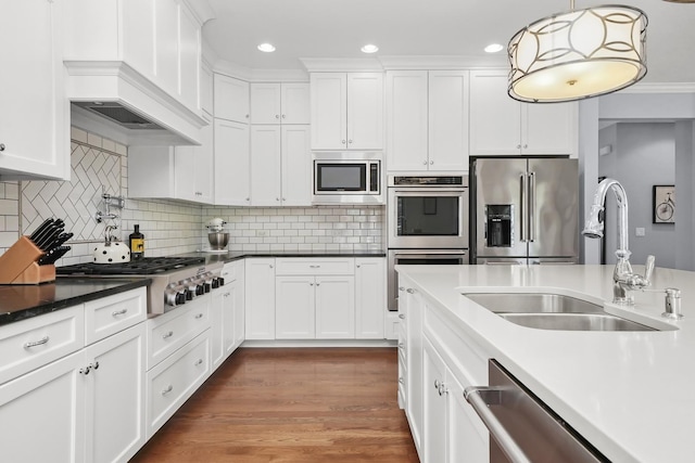 13616 S Erin Dr, Homer Glen, IL 60491 - kitchen with appliances with stainless steel finishes, white cabinetry, hanging light fixtures, decorative backsplash, and recessed lighting