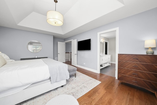 13616 S Erin Dr, Homer Glen, IL 60491 - bedroom featuring a raised ceiling, wood finished floors, and connected bathroom