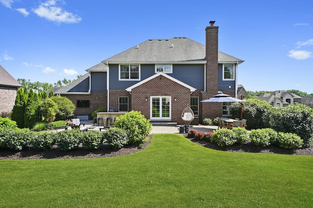 13616 S Erin Dr, Homer Glen, IL 60491 - rear view of house featuring a chimney, a patio, a lawn, and a shingled roof