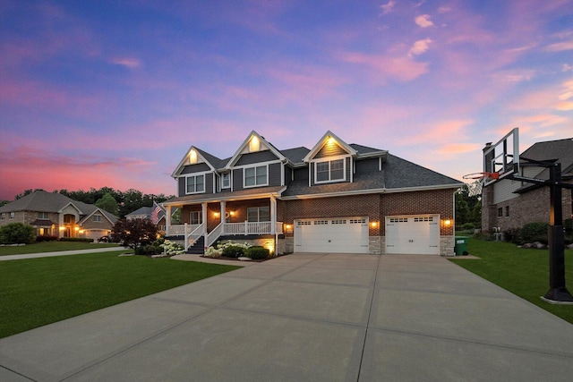 13616 S Erin Dr, Homer Glen, IL 60491 - view of front of house with a porch, a yard, concrete driveway, and stone siding