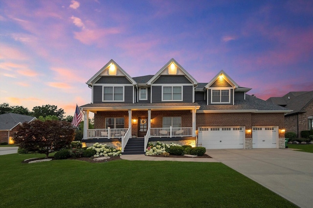 13616 S Erin Dr, Homer Glen, IL 60491 - view of front facade featuring driveway, covered porch, a front lawn, and stone siding