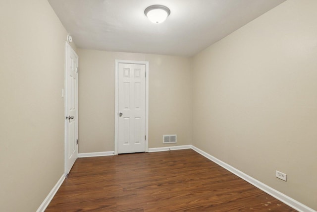9832 S Oglesby Ave, Chicago, IL 60617 - unfurnished room featuring dark wood-style floors and baseboards