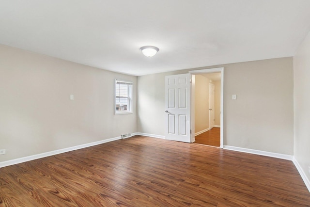 9832 S Oglesby Ave, Chicago, IL 60617 - unfurnished room with wood finished floors and baseboards