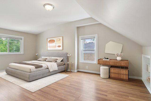 9832 S Oglesby Ave, Chicago, IL 60617 - bedroom featuring vaulted ceiling and wood finished floors