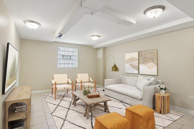9832 S Oglesby Ave, Chicago, IL 60617 - living room with light tile patterned flooring and baseboards
