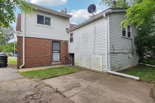 9832 S Oglesby Ave, Chicago, IL 60617 - back of property with brick siding and a patio area