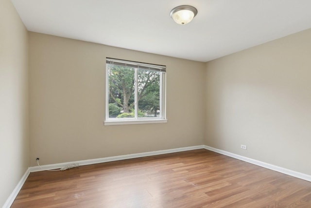 9832 S Oglesby Ave, Chicago, IL 60617 - empty room with wood finished floors and baseboards