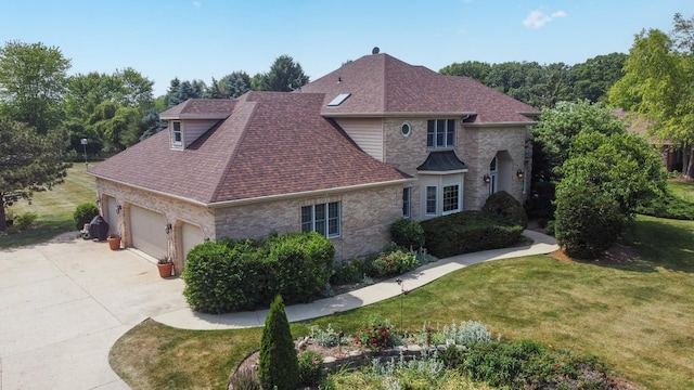 14N924 White Pines Ln, Hampshire, IL 60140 - view of front of property with roof with shingles, a front yard, driveway, and a garage