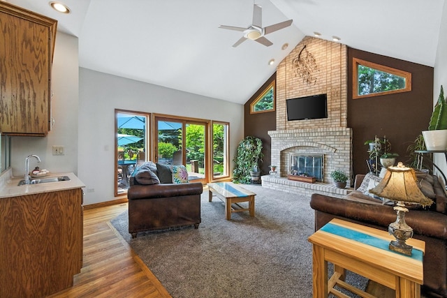 14N924 White Pines Ln, Hampshire, IL 60140 - living room with a ceiling fan, high vaulted ceiling, a brick fireplace, light wood finished floors, and recessed lighting
