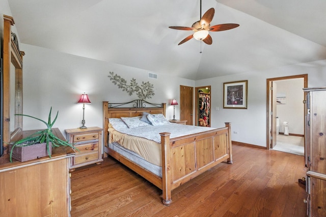 14N924 White Pines Ln, Hampshire, IL 60140 - bedroom featuring light wood-style flooring, lofted ceiling, a spacious closet, a closet, and ensuite bath