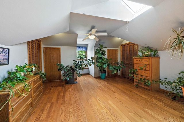 14N924 White Pines Ln, Hampshire, IL 60140 - living area featuring light wood-style floors, a ceiling fan, a skylight, and lofted ceiling