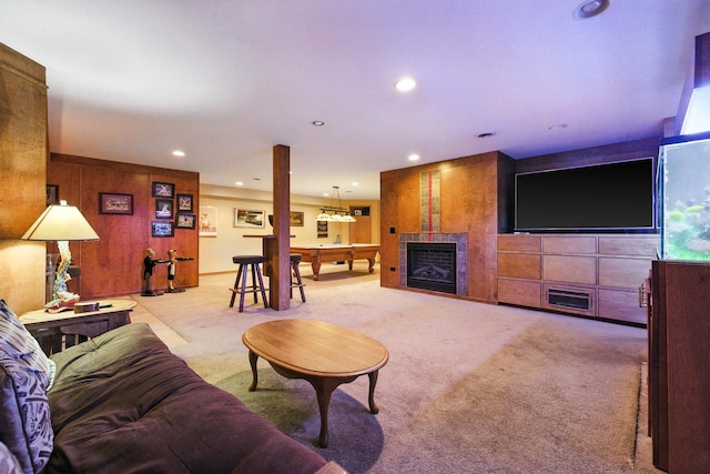 14N924 White Pines Ln, Hampshire, IL 60140 - carpeted living room featuring wooden walls, a fireplace, and recessed lighting