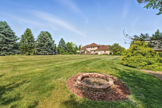 14N924 White Pines Ln, Hampshire, IL 60140 - view of green lawn with an outdoor fire pit