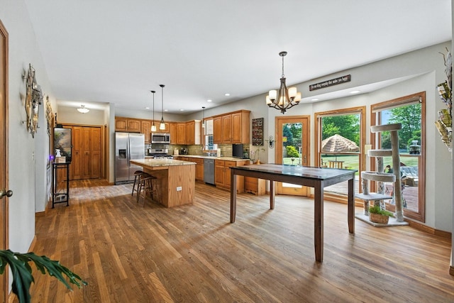 14N924 White Pines Ln, Hampshire, IL 60140 - dining space featuring wood finished floors, a chandelier, and recessed lighting