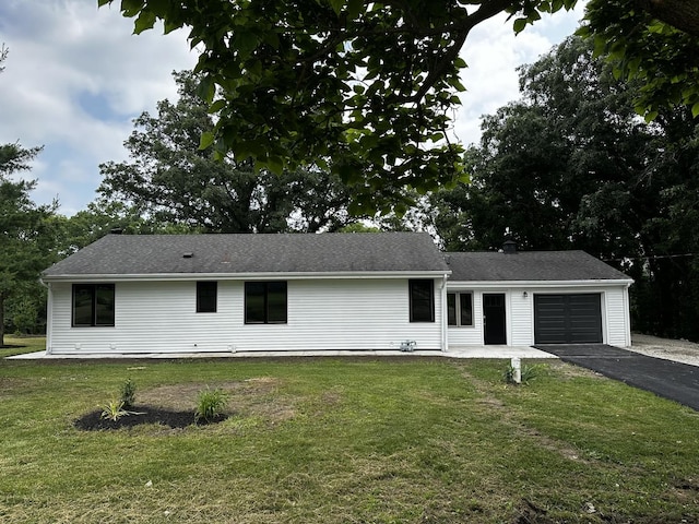 2212 N 2829th Rd, Marseilles, IL 61341 - view of front of home with asphalt driveway, a garage, and a front yard