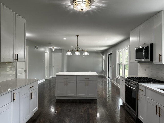 2212 N 2829th Rd, Marseilles, IL 61341 - kitchen with appliances with stainless steel finishes, dark wood-style floors, recessed lighting, backsplash, and light countertops