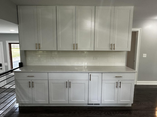 2212 N 2829th Rd, Marseilles, IL 61341 - kitchen with dark wood-style floors, tasteful backsplash, and white cabinets