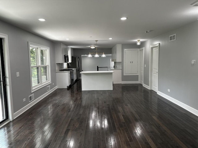 2212 N 2829th Rd, Marseilles, IL 61341 - unfurnished living room with dark wood finished floors, recessed lighting, and a chandelier