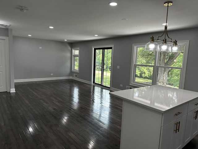 2212 N 2829th Rd, Marseilles, IL 61341 - kitchen featuring open floor plan, dark wood-style flooring, recessed lighting, pendant lighting, and white cabinetry