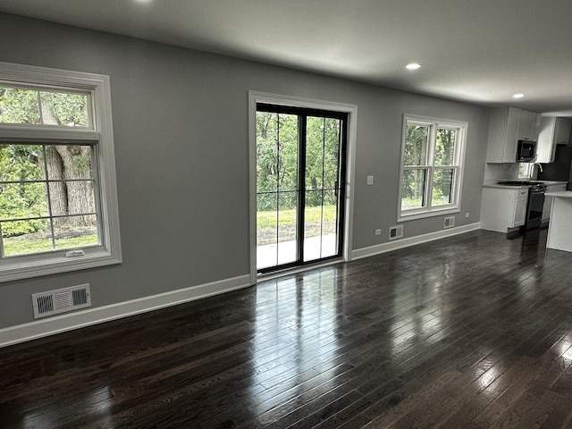 2212 N 2829th Rd, Marseilles, IL 61341 - unfurnished living room with dark wood-type flooring and recessed lighting