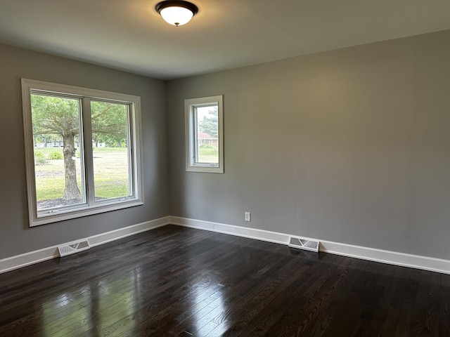 2212 N 2829th Rd, Marseilles, IL 61341 - spare room featuring baseboards and dark wood-style floors