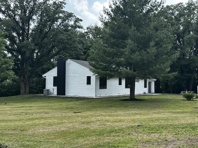 2212 N 2829th Rd, Marseilles, IL 61341 - view of property exterior featuring a chimney and a lawn