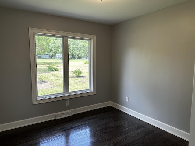 2212 N 2829th Rd, Marseilles, IL 61341 - empty room featuring dark wood-style flooring and baseboards