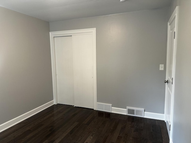 2212 N 2829th Rd, Marseilles, IL 61341 - unfurnished bedroom featuring dark wood-style flooring and a closet