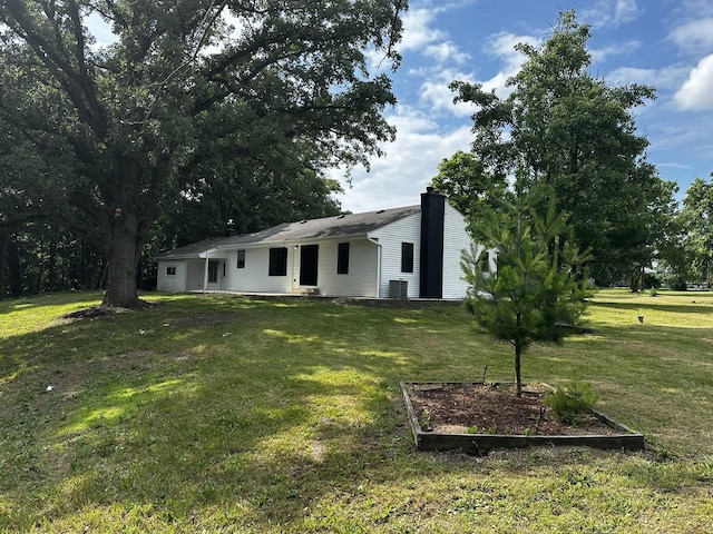 2212 N 2829th Rd, Marseilles, IL 61341 - view of front facade featuring a front lawn and a chimney
