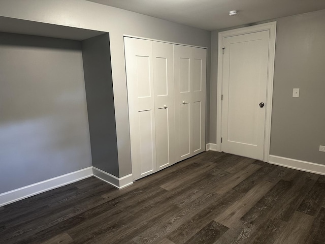 2212 N 2829th Rd, Marseilles, IL 61341 - unfurnished bedroom with dark wood-style floors and a closet