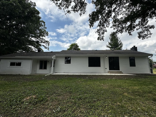2212 N 2829th Rd, Marseilles, IL 61341 - rear view of house with a lawn, a chimney, and a patio area