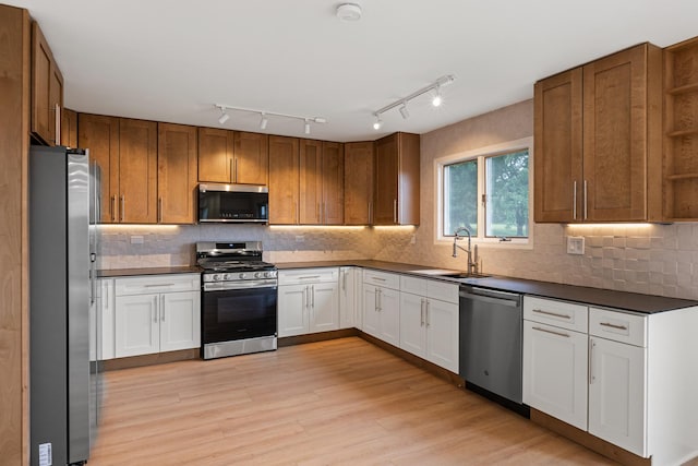 747 Jamestowne Ct, Sleepy Hollow, IL 60118 - kitchen with stainless steel appliances, dark countertops, open shelves, and light wood-type flooring