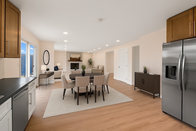 747 Jamestowne Ct, Sleepy Hollow, IL 60118 - dining area with light wood-style flooring, a brick fireplace, and recessed lighting